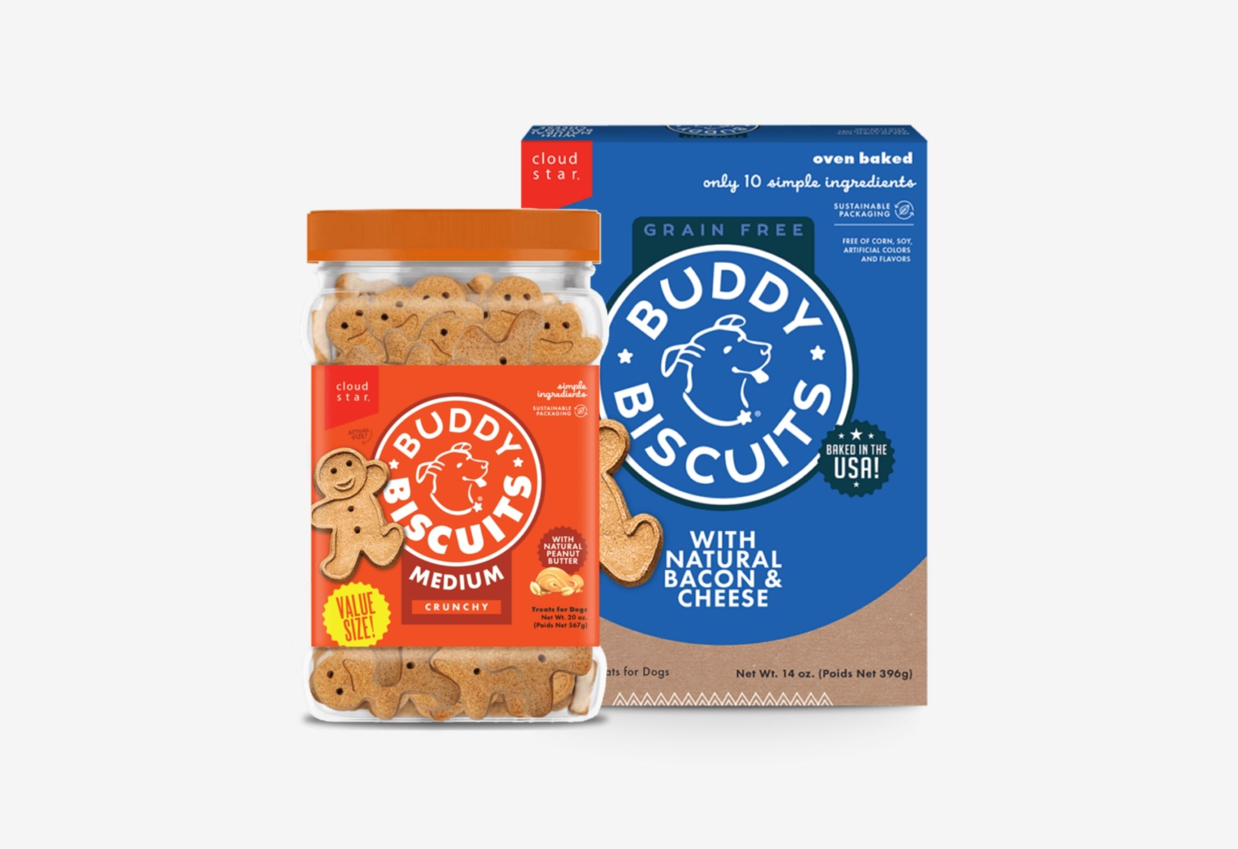A clear plastic jar filled with gingerbread-man shaped Cloud Star Buddy Biscuits dog treats, labeled "Medium Crunchy With Natural Peanut Butter." Next to it is a blue and brown box of Cloud Star Buddy Biscuits, "Grain Free With Natural Bacon & Cheese."